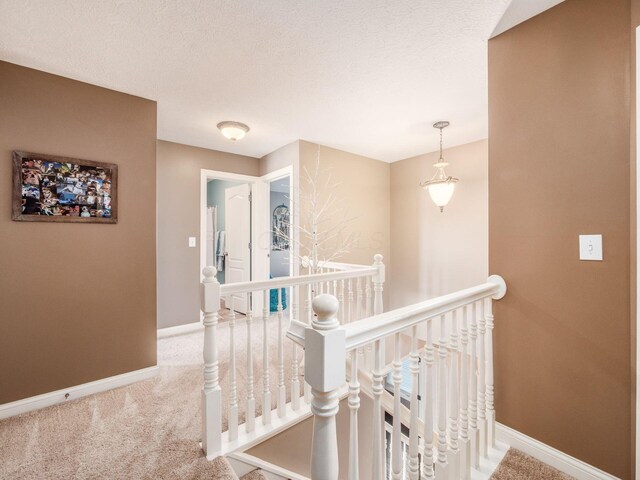 7635 Overland Trl, Delaware, OH 43015 - hallway featuring an upstairs landing and carpet flooring