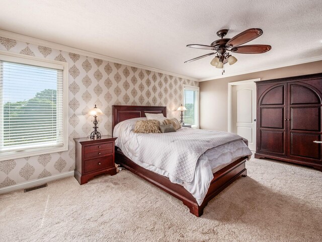 7635 Overland Trl, Delaware, OH 43015 - carpeted bedroom featuring wallpapered walls, crown molding, and a ceiling fan