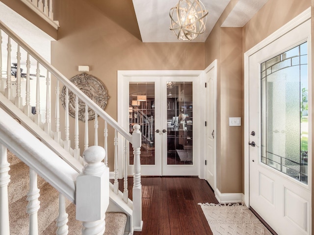7635 Overland Trl, Delaware, OH 43015 - foyer featuring french doors, wood-type flooring, a chandelier, and stairway