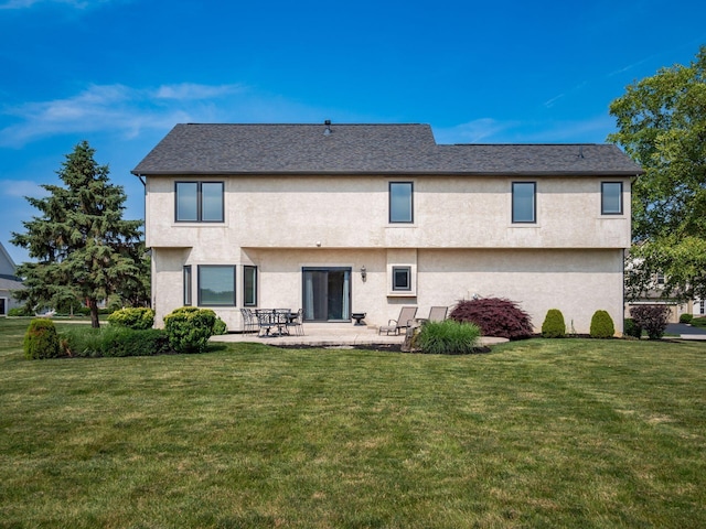 7635 Overland Trl, Delaware, OH 43015 - back of house featuring a patio, stucco siding, and a yard