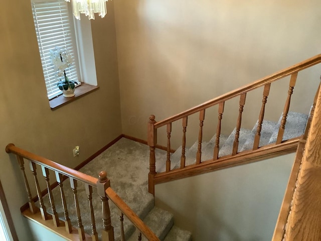 374 Chatham Rd, Circleville, OH 43113 - stairway featuring carpet and a chandelier