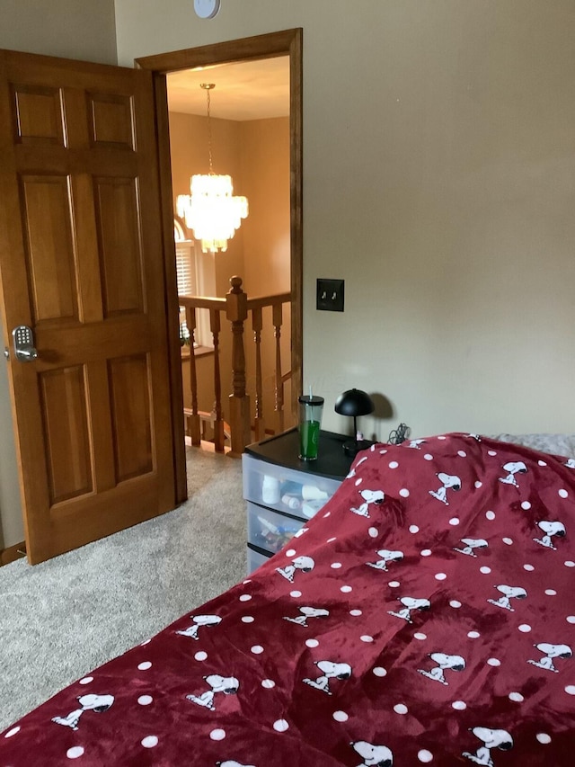 374 Chatham Rd, Circleville, OH 43113 - bedroom with carpet and a chandelier