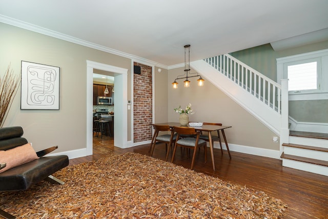 489 Elsmere St, Columbus, OH 43206 - dining area with stairs, dark wood finished floors, and crown molding