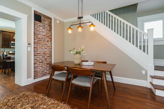 489 Elsmere St, Columbus, OH 43206 - dining space featuring stairway, dark wood-style flooring, and ornamental molding