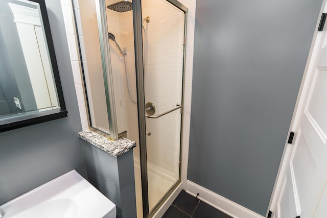 489 Elsmere St, Columbus, OH 43206 - bathroom with a shower stall and tile patterned floors