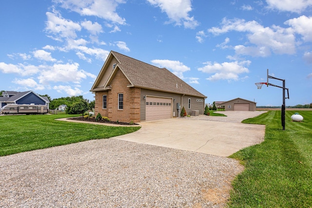 5582 Hayesville Rd, Circleville, OH 43113 - view of home's exterior featuring brick siding, a yard, a detached garage, and a shingled roof