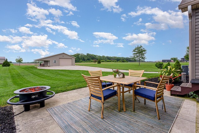 5582 Hayesville Rd, Circleville, OH 43113 - deck featuring outdoor dining space, a yard, a garage, a patio area, and an outbuilding