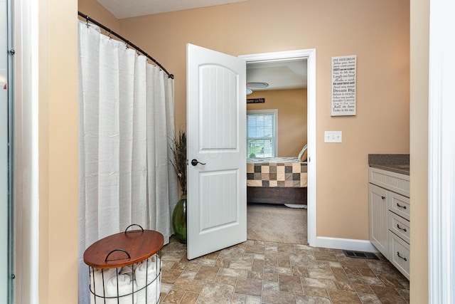 5582 Hayesville Rd, Circleville, OH 43113 - full bathroom with vanity, stone finish flooring, and ensuite bath