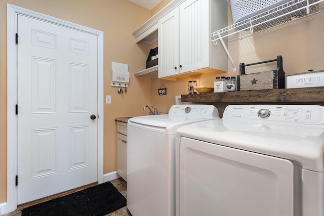 5582 Hayesville Rd, Circleville, OH 43113 - laundry area with washer and clothes dryer and cabinet space