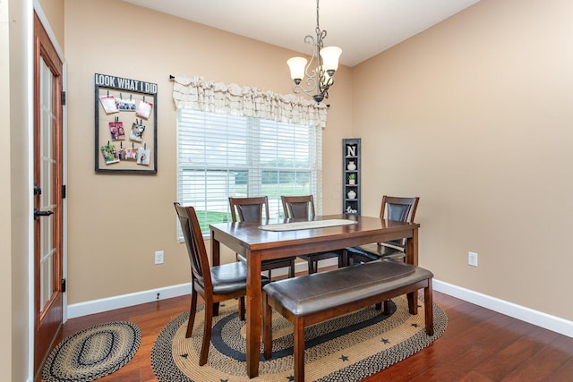 5582 Hayesville Rd, Circleville, OH 43113 - dining area featuring dark wood-style floors and a chandelier