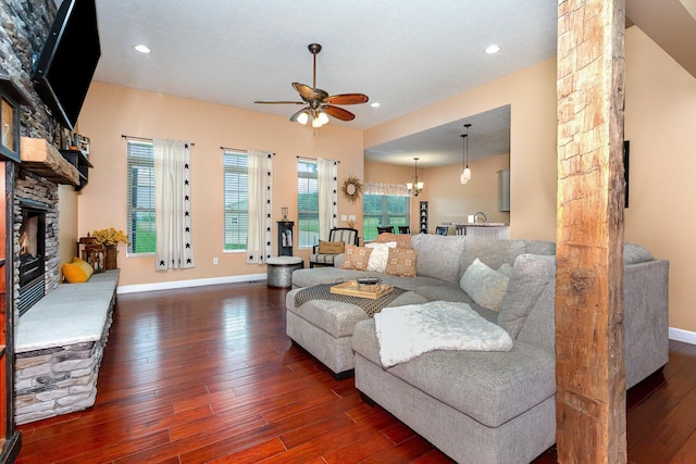 5582 Hayesville Rd, Circleville, OH 43113 - living area with a ceiling fan, a fireplace, dark wood-style floors, recessed lighting, and a chandelier
