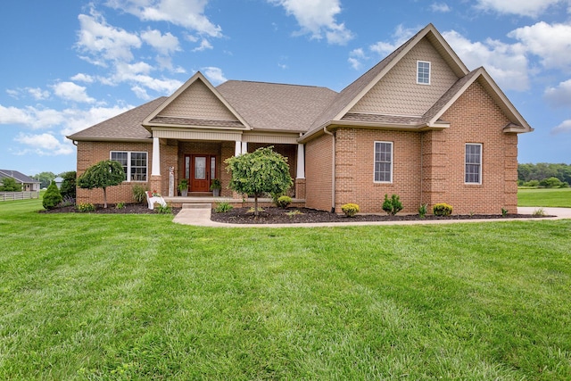 5582 Hayesville Rd, Circleville, OH 43113 - craftsman-style house with brick siding, a front yard, and a shingled roof