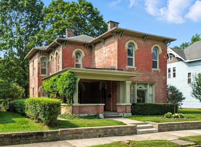 249 W Locust St, Newark, OH 43055 - italianate house with brick siding, a chimney, a front lawn, and covered porch
