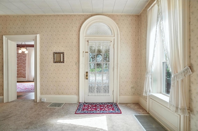 249 W Locust St, Newark, OH 43055 - carpeted entrance foyer with wallpapered walls and a chandelier