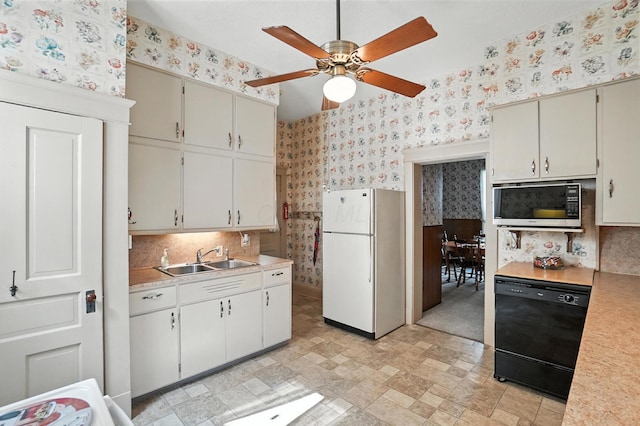 249 W Locust St, Newark, OH 43055 - kitchen with freestanding refrigerator, wallpapered walls, dishwasher, stainless steel microwave, and light countertops