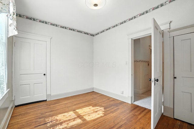 249 W Locust St, Newark, OH 43055 - spare room featuring wood finished floors and baseboards
