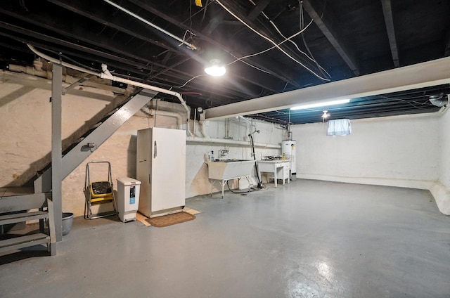 249 W Locust St, Newark, OH 43055 - unfinished basement with water heater and a sink