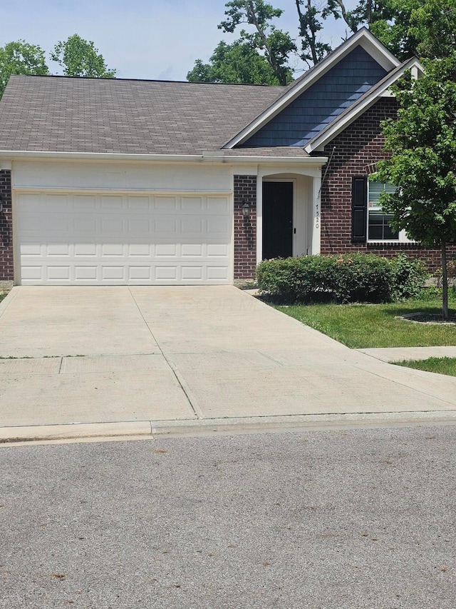 7520 Autumn Joy Ave, Canal Winchester, OH 43110 - single story home with brick siding, driveway, and an attached garage