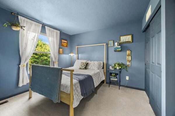 5813 Camhurst Ct, Galloway, OH 43119 - carpeted bedroom with a textured ceiling