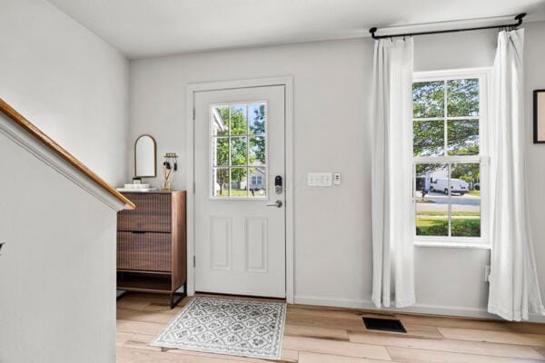 5813 Camhurst Ct, Galloway, OH 43119 - foyer entrance featuring plenty of natural light and light wood finished floors