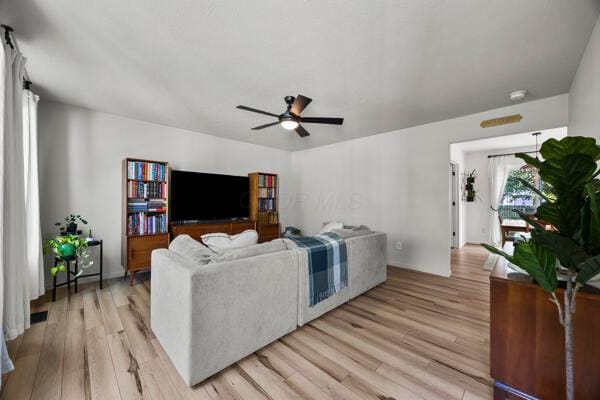 5813 Camhurst Ct, Galloway, OH 43119 - living area with ceiling fan and light wood-style flooring