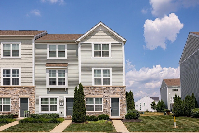 5738 Hayden Run Blvd, Dublin, OH 43016 - multi unit property with stone siding and a front yard