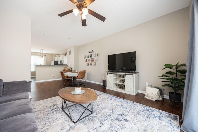 5738 Hayden Run Blvd, Dublin, OH 43016 - living area featuring dark wood finished floors and ceiling fan