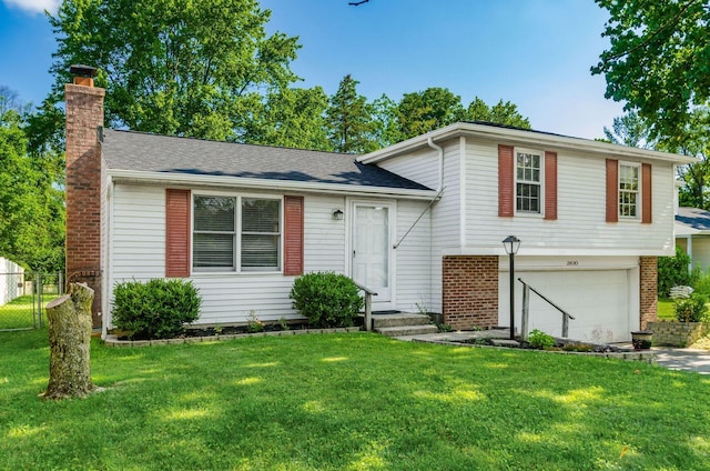 2630 Bella Via Ave, Columbus, OH 43231 - tri-level home featuring a chimney, a garage, brick siding, and driveway