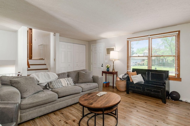 2630 Bella Via Ave, Columbus, OH 43231 - living area with light wood-type flooring and a textured ceiling