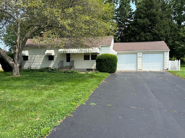 298 N Vernon Ave, Newark, OH 43055 - view of front of house featuring a front lawn, driveway, a shingled roof, and an attached garage