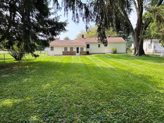 298 N Vernon Ave, Newark, OH 43055 - back of property featuring a fenced backyard and a chimney