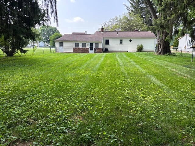 298 N Vernon Ave, Newark, OH 43055 - back of property featuring a fenced backyard and a chimney