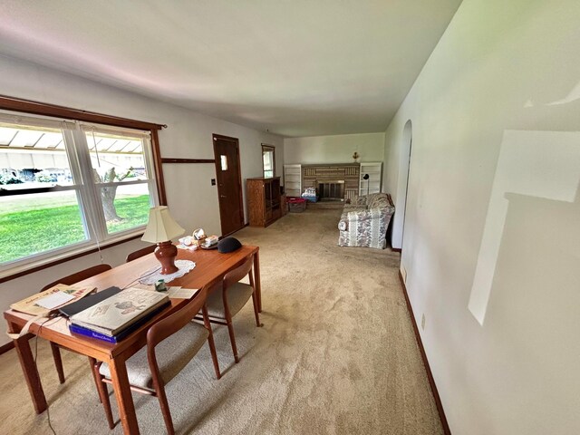 298 N Vernon Ave, Newark, OH 43055 - dining area featuring light carpet and a glass covered fireplace