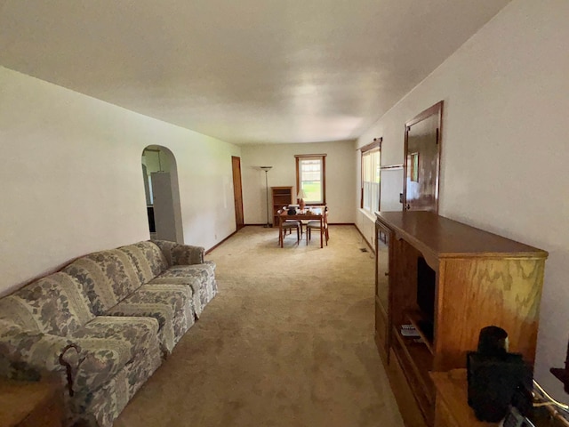 298 N Vernon Ave, Newark, OH 43055 - living room featuring arched walkways and light colored carpet
