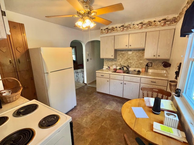 298 N Vernon Ave, Newark, OH 43055 - kitchen featuring white appliances, arched walkways, light countertops, tasteful backsplash, and ceiling fan