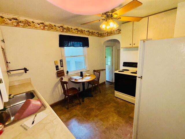 298 N Vernon Ave, Newark, OH 43055 - kitchen featuring white appliances, arched walkways, light countertops, and ceiling fan