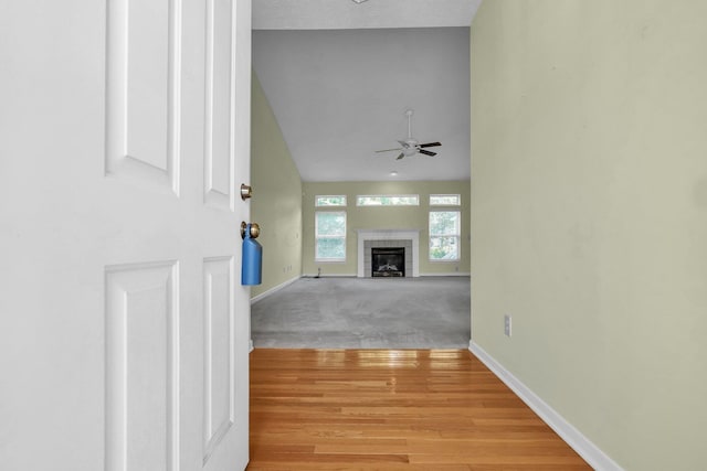 8078 Slate Ridge Blvd, Reynoldsburg, OH 43068 - unfurnished living room with ceiling fan, a fireplace, and light wood-type flooring