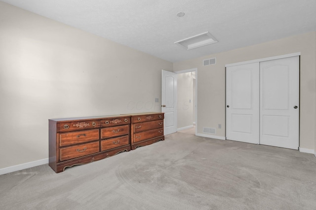 8078 Slate Ridge Blvd, Reynoldsburg, OH 43068 - unfurnished bedroom featuring attic access, carpet floors, and a closet