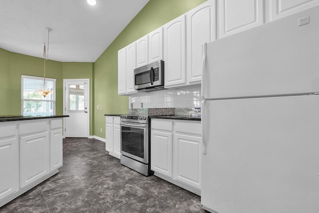 8078 Slate Ridge Blvd, Reynoldsburg, OH 43068 - kitchen with appliances with stainless steel finishes, dark countertops, decorative backsplash, white cabinets, and recessed lighting