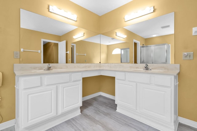 8078 Slate Ridge Blvd, Reynoldsburg, OH 43068 - bathroom featuring double vanity and a shower with door