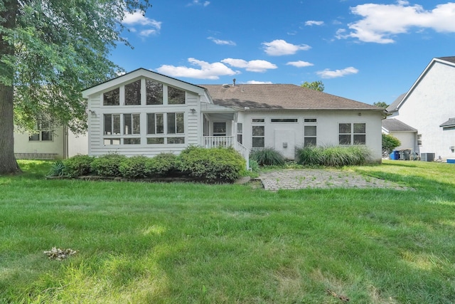 8078 Slate Ridge Blvd, Reynoldsburg, OH 43068 - back of house featuring a yard, stucco siding, and a shingled roof