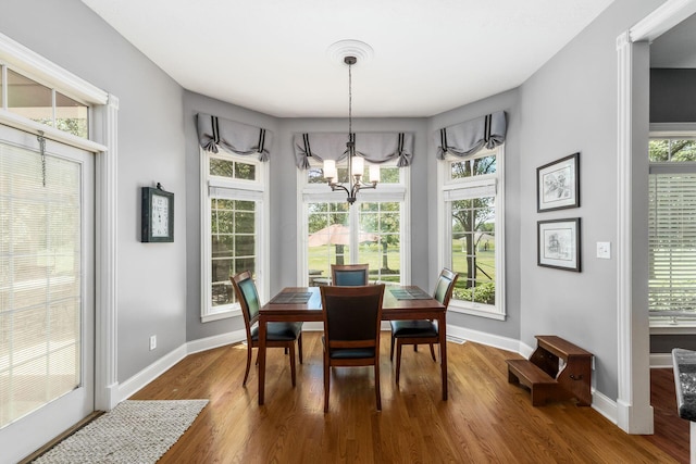 3873 Carters Corner Rd, Sunbury, OH 43074 - dining area featuring a chandelier and wood finished floors