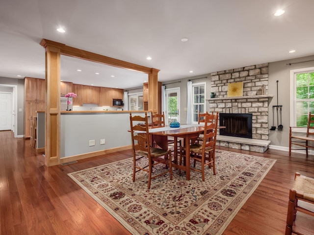 4656 Crompton Dr, Columbus, OH 43220 - dining space featuring wood finished floors, recessed lighting, and a stone fireplace