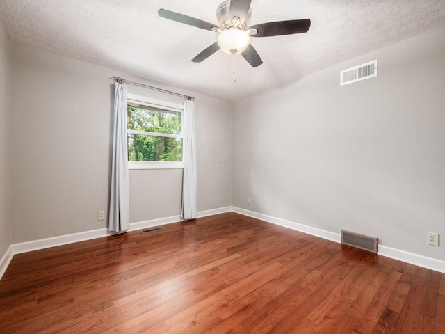 4656 Crompton Dr, Columbus, OH 43220 - empty room with wood finished floors, ceiling fan, and a textured ceiling