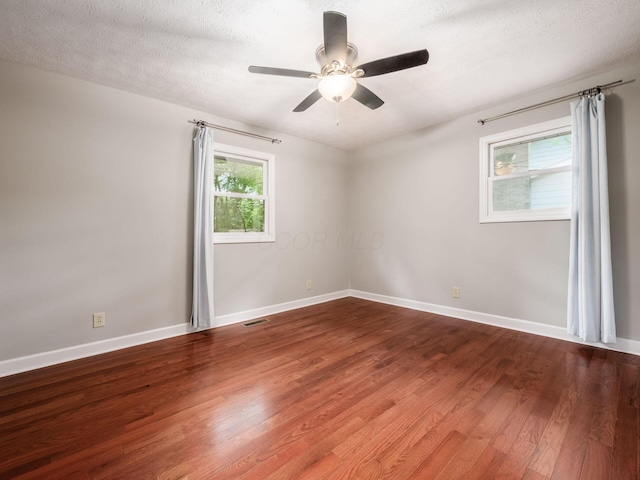 4656 Crompton Dr, Columbus, OH 43220 - empty room with wood finished floors, ceiling fan, and a textured ceiling