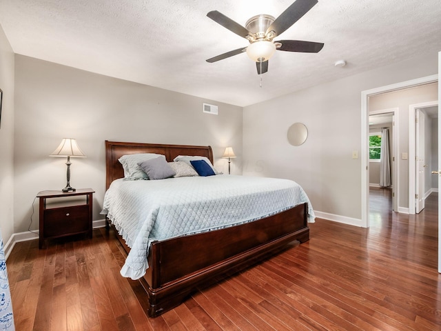 4656 Crompton Dr, Columbus, OH 43220 - bedroom with hardwood / wood-style flooring, ceiling fan, and a textured ceiling