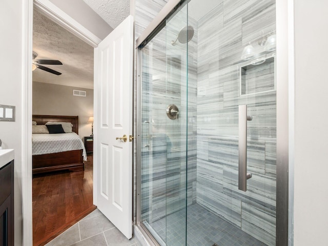 4656 Crompton Dr, Columbus, OH 43220 - full bath with ensuite bath, vanity, a stall shower, and a textured ceiling