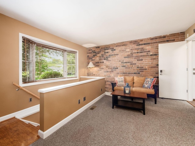 4656 Crompton Dr, Columbus, OH 43220 - sitting room featuring brick wall and carpet