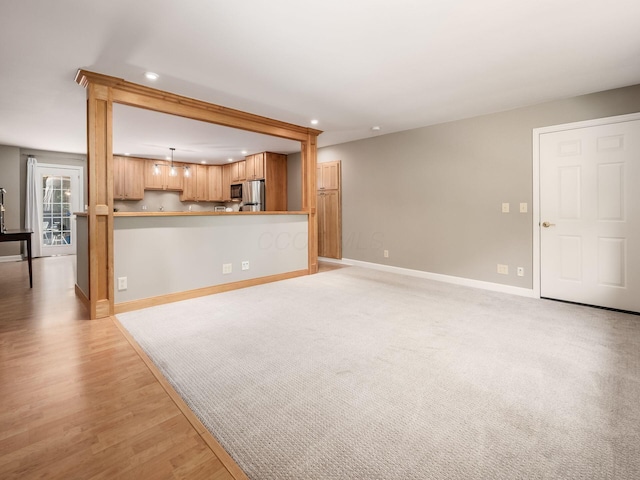 4656 Crompton Dr, Columbus, OH 43220 - unfurnished living room with recessed lighting and light wood-style floors