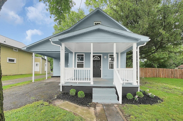 540 Park St, Marion, OH 43302 - view of front facade with a porch, asphalt driveway, and a carport